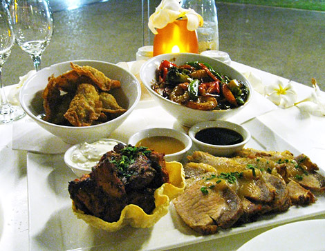 Tandoori chicken, fried wontons, roast pork with apple sauce, stir fried prawns and vegetables